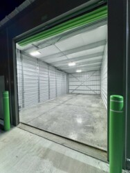 Inside a large drive-up storage unit/rv, boat, and car storage garage