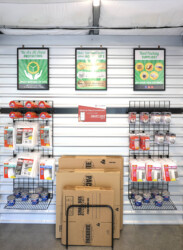 Moving supplies on the wall for sale such as locks, packing tape, and boxes