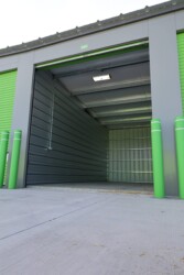 Inside a large drive-up storage unit/rv, boat, and car storage garage